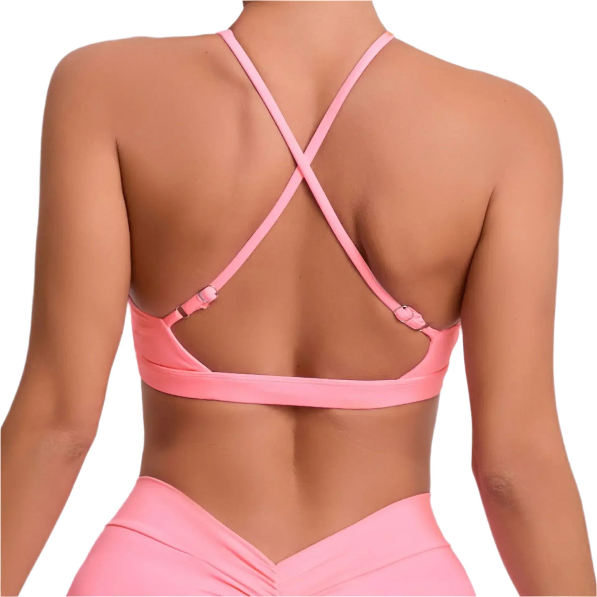 Pink sports bra and leggings set on a plain background